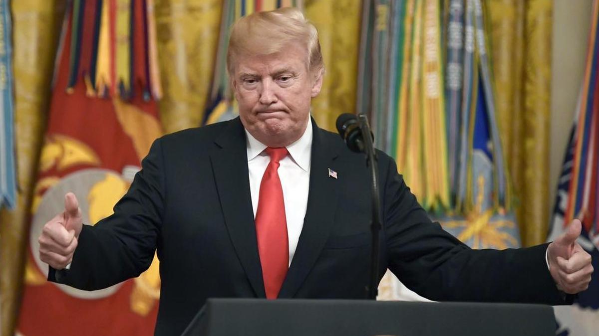 In this file photo taken on Wednesday, Sept. 12, 2018, President Donald Trump speaks during a Congressional Medal of Honor Society reception in the East Room of the White House in Washington.