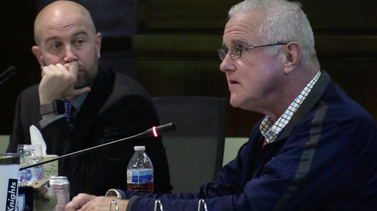 Fresno Unified School District Trustee Terry Slatic, right, at his last board meeting, asks questions with board member Andy Levine to the left on Wednesday, Dec. 7, in Fresno.
