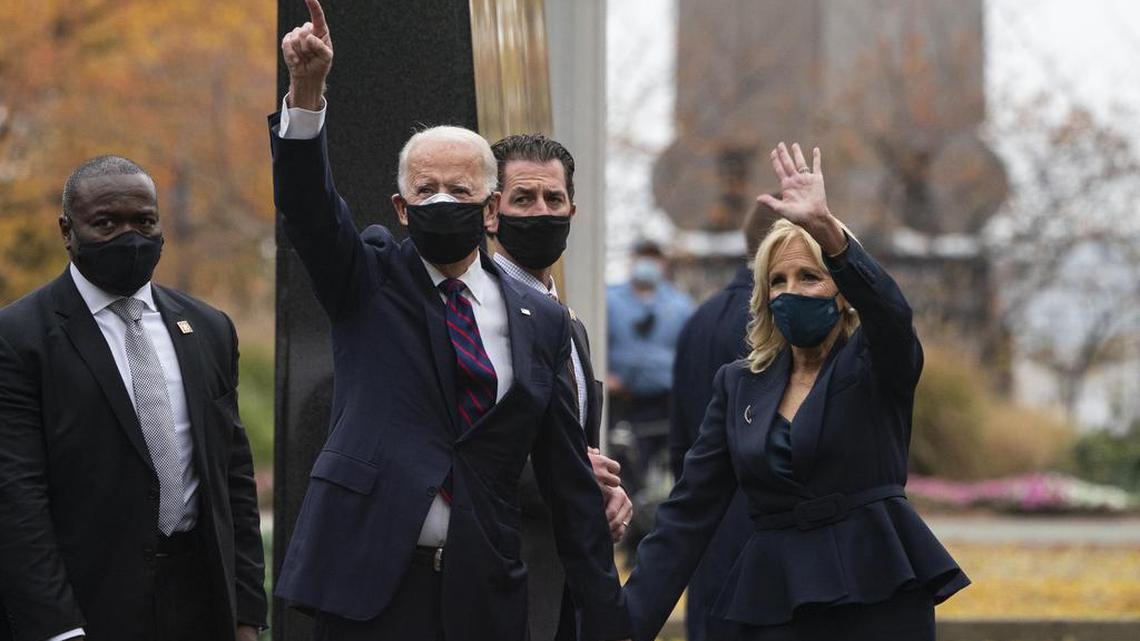 President-elect Joe Biden and his wife Jill Biden, wave during a Veterans Day ceremony on Wednesday, Nov. 11, 2020, in Philadelphia. Biden has presented an education agenda that is starkly different from the Trump era, beginning with a far more cautious approach to school reopenings.