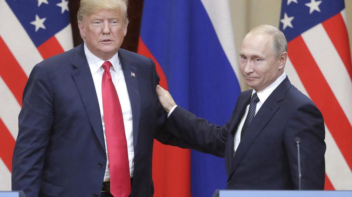 U.S. President Donald Trump, left, and Russian President Vladimir Putin give a joint news conference following their meeting at the Presidential Palace in Helsinki, Finland, on July 16, 2018.