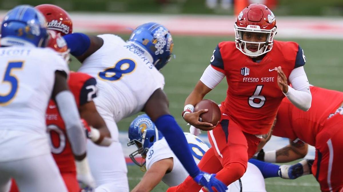 Fresno State quarterback Marcus McMaryion, center, runs against San Jose State during a November game.