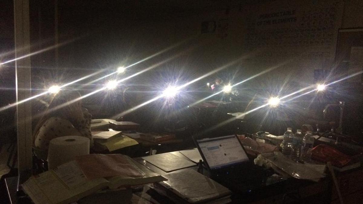 When the power went out at Hoover High School, chemistry students used the lights on their cell phones to illuminate the room and complete a Double Replacement Reaction assignment.