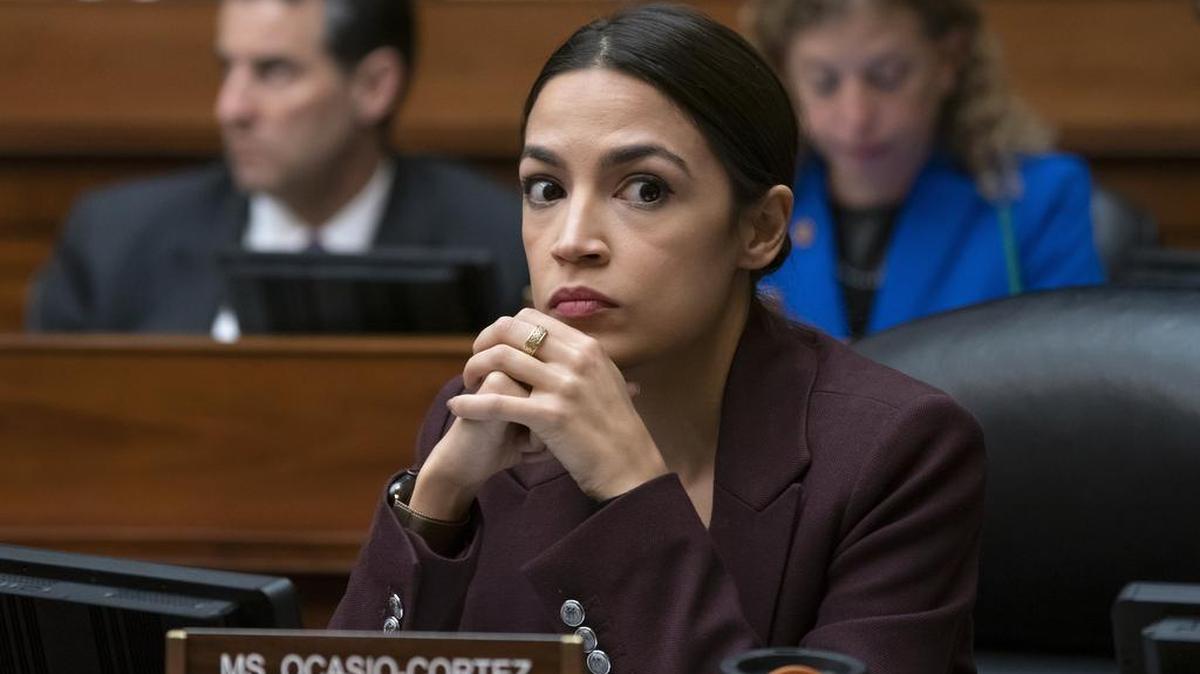 In this Feb. 27, 2019, photo, Rep. Alexandria Ocasio-Cortez, D-N.Y., listens to questioning of Michael Cohen on Capitol Hill in Washington. She was portrayed in a bad light in a recent video played at a Fresno Grizzlies game.