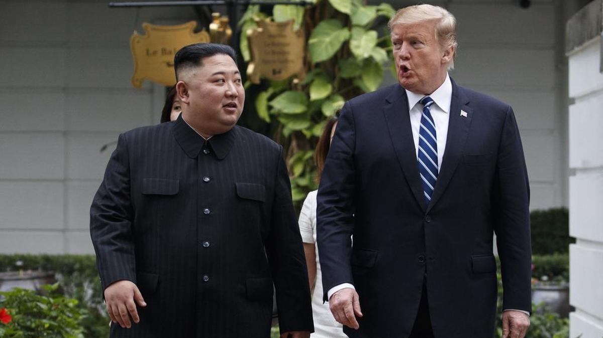 In this Feb. 28, 2019 photo, President Donald Trump and North Korean leader Kim Jong Un take a walk after their first meeting at the Sofitel Legend Metropole Hanoi hotel, in Hanoi.