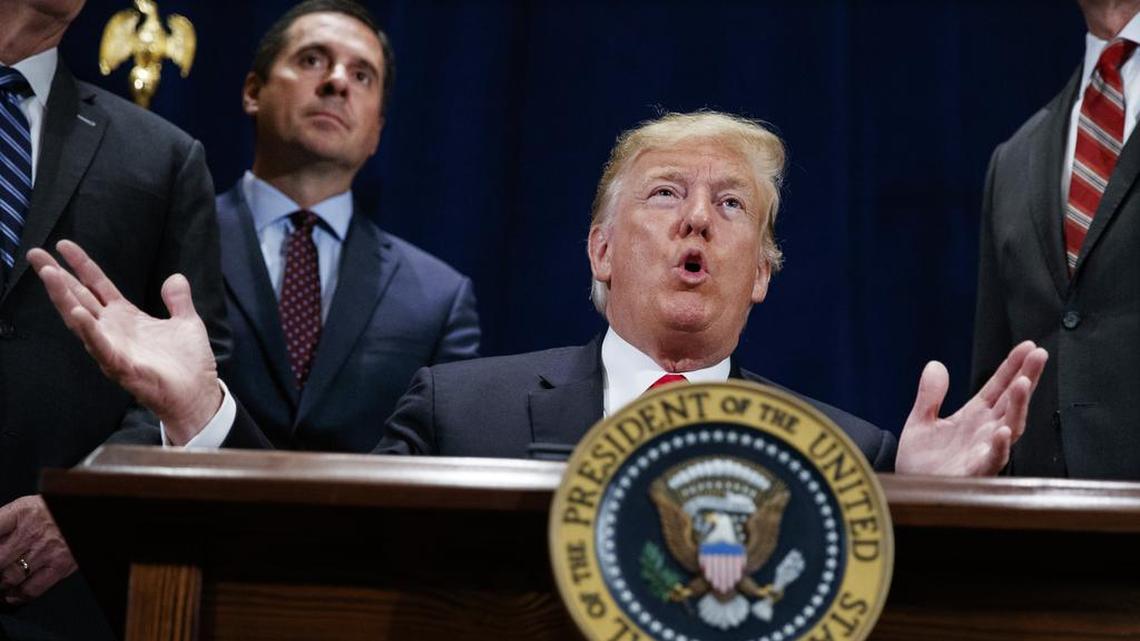 Then-President Donald Trump speaks during a 2018 ceremony in Scottsdale, Ariz. Standing behind the president is then-Rep. Devin Nunes, R-Tulare. Nunes left the House to lead Trump’s effort to launch a social media platform intended to rival Twitter, which blocked Trump’s account following the deadly storming of the U.S. Capitol.