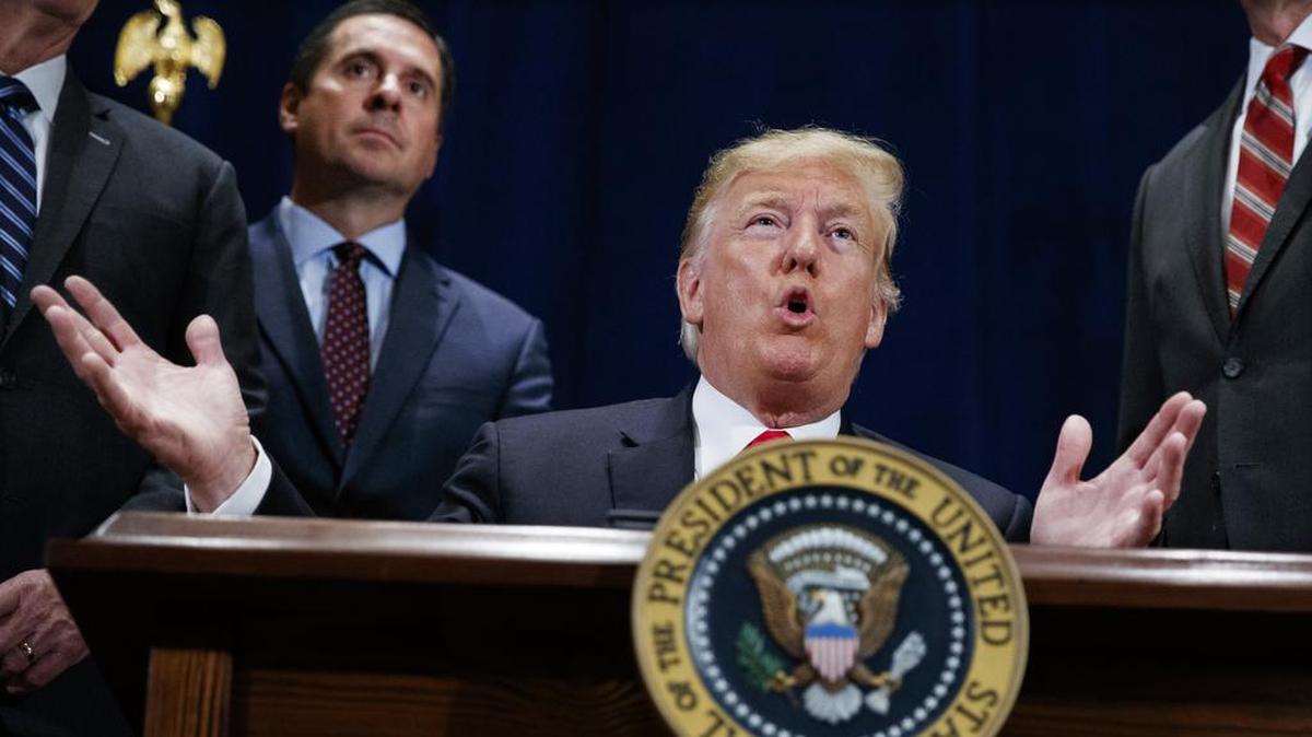 President Donald Trump speaks during a ceremony to sign a “Presidential Memorandum Promoting the Reliable Supply and Delivery of Water in the West,” Oct. 19, 2018, in Scottsdale, Ariz. Standing behind the president is Rep. Devin Nunes, R-Tulare. Nunes is leaving the House at the end of this year to lead former Trump's effort to launch a social media platform intended to rival Twitter.