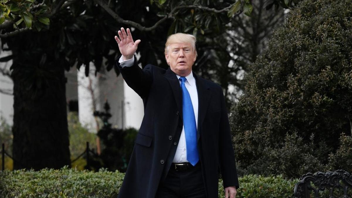 U.S. President Donald Trump waves to guests at the conclusion of an event to celebrate passage of the Tax Cuts and Jobs Act on Wednesday on the South Lawn of the White House in Washington, D.C.