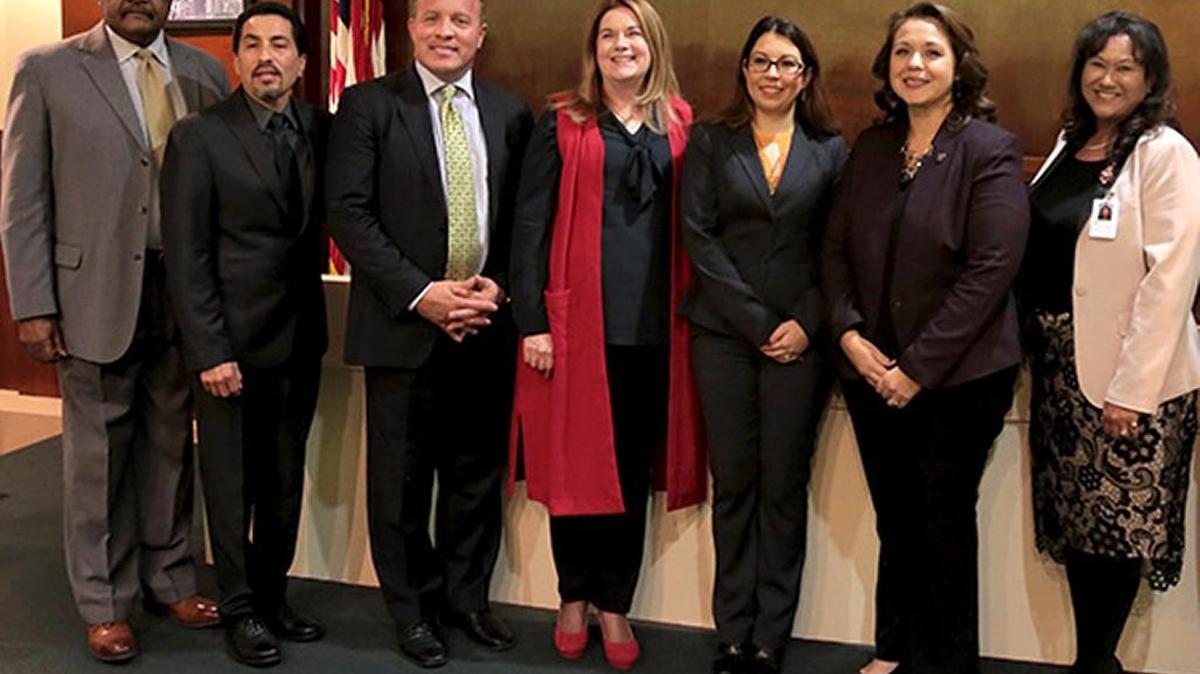 The Fresno Unified school board, from left: Cal Johnson, Christopher De La Cerda, Brooke Ashjian, Carol Mills, Elizabeth Jonasson Rosas, Claudia Cazares, Valerie Davis. /