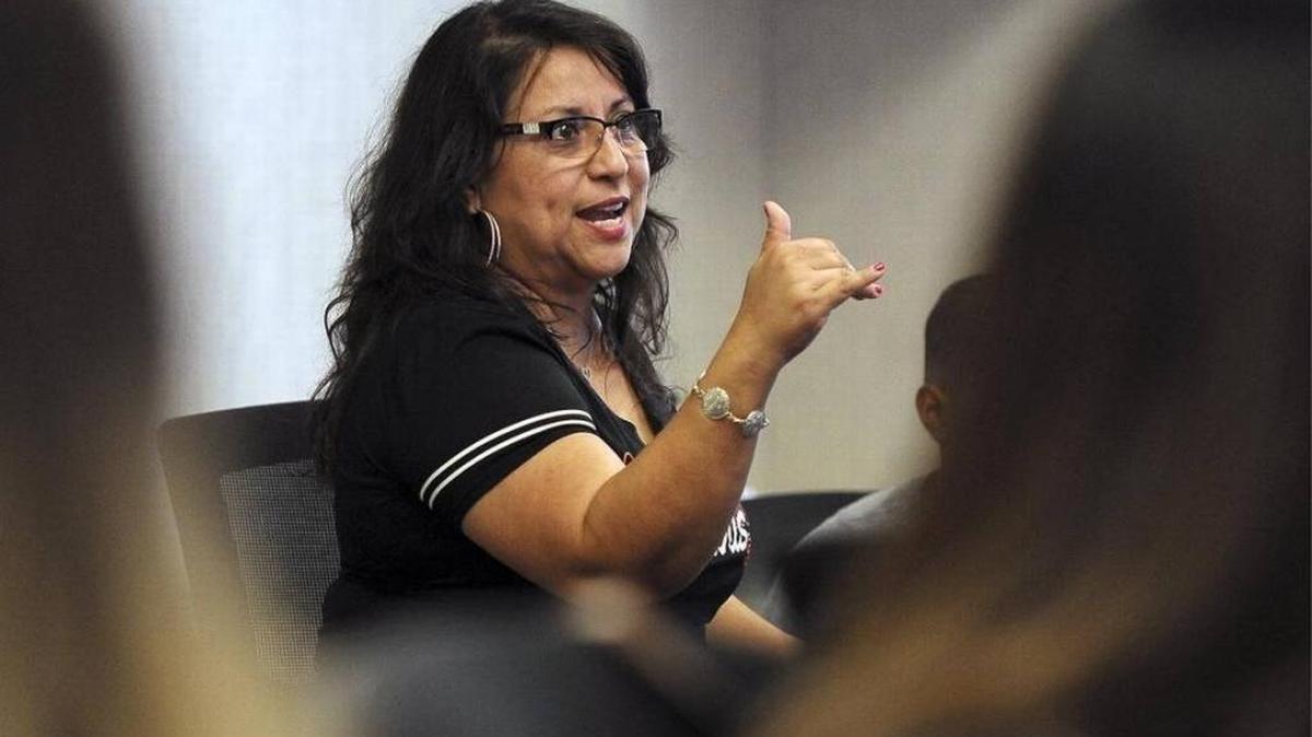 Sandra Flores, program director for the Fresno County Preterm Birth Initiative, addresses those gathered for a health and education meeting Sept. 12.