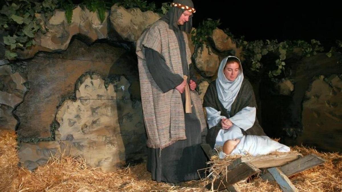 Russell Snell and his wife Ambria work on their parts as Joseph and Mary with the baby Jesus in the manger scene at the Living Nativity Drive-Thru at Riverdale Assembly of God Church in Riverdale in this 2012 photo.