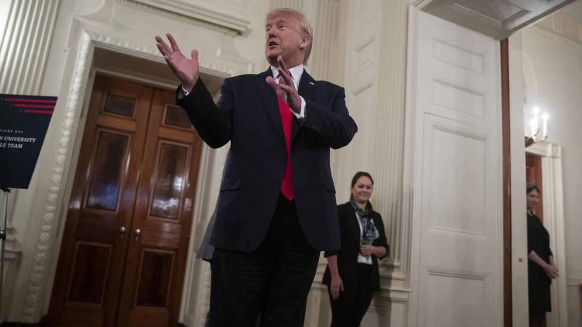 President Donald Trump talks with reporters during the NCAA Collegiate National Champions Day at the White House, Friday, Nov. 22, 2019, in Washington.