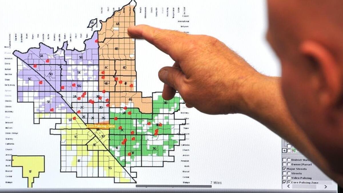 Fresno Police Chief Jerry Dyer shows a map showing domestic violence instances within the city.