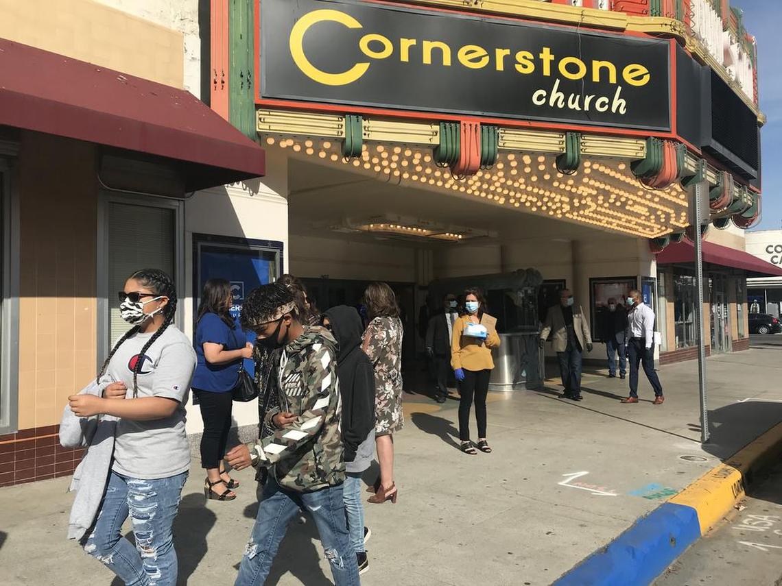 Church goers arrive at Cornerstone Church in downtown Fresno Sunday wearing masks, as churches got the green light to reopen in California with certain limitations. The church defied state and county guidelines with the number of congregants it invited and by singing hymns.