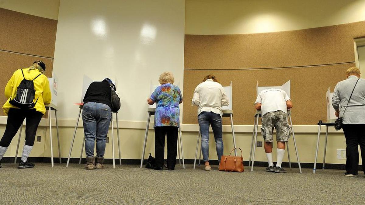 Voters fill the voting booths at the Woodward Park Regional Library voting precinct Tuesday morning, Nov. 6, 2018.