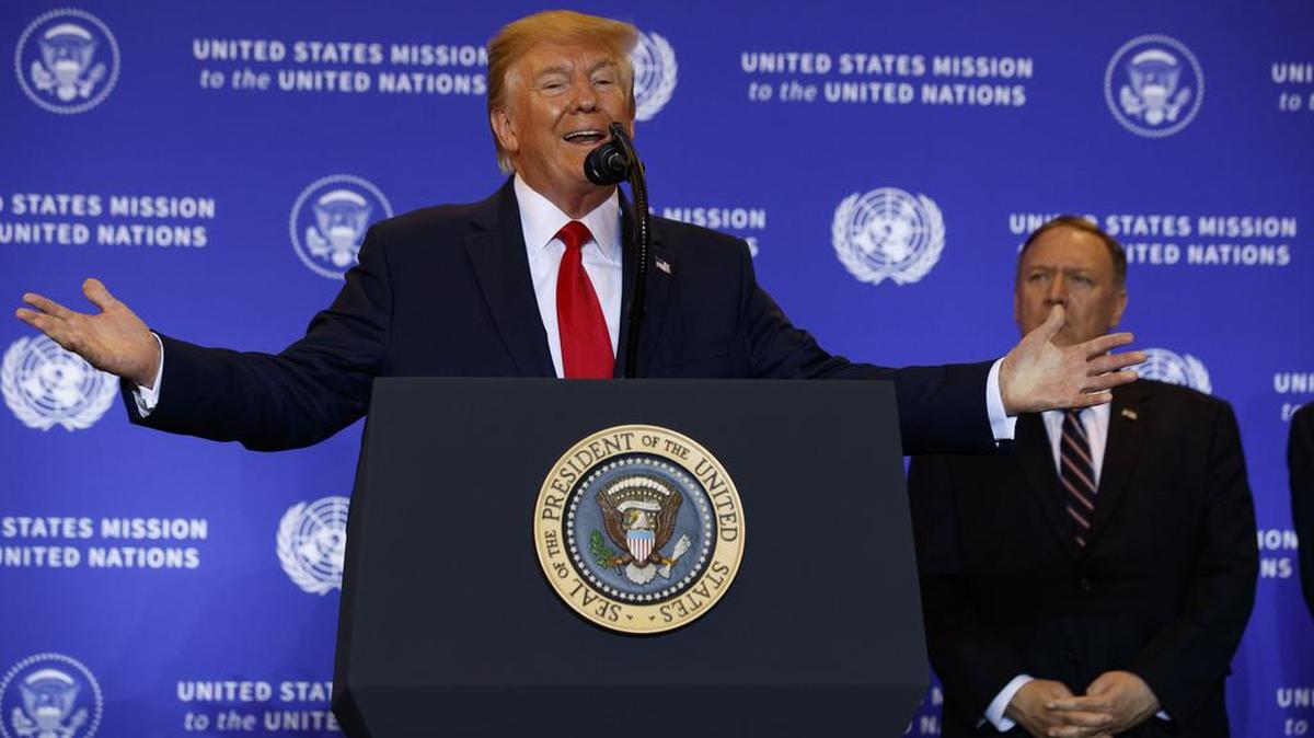 Secretary of State Mike Pompeo listens as President Donald Trump speaks during a news conference at the InterContinental Barclay New York hotel during the United Nations General Assembly, Wednesday, Sept. 25, 2019, in New York.