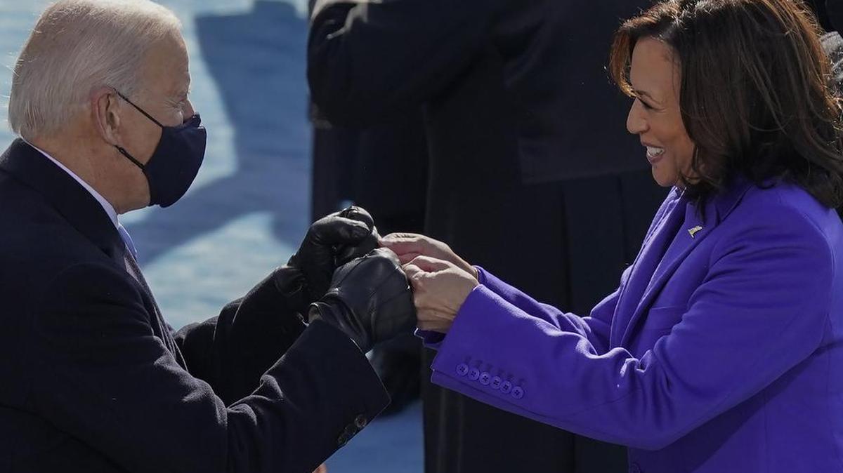 President-elect Joe Biden congratulates Vice President Kamala Harris with a fist bump after she was sworn in during the 59th Presidential Inauguration at the U.S. Capitol in Washington, Wednesday, Jan. 20, 2021.