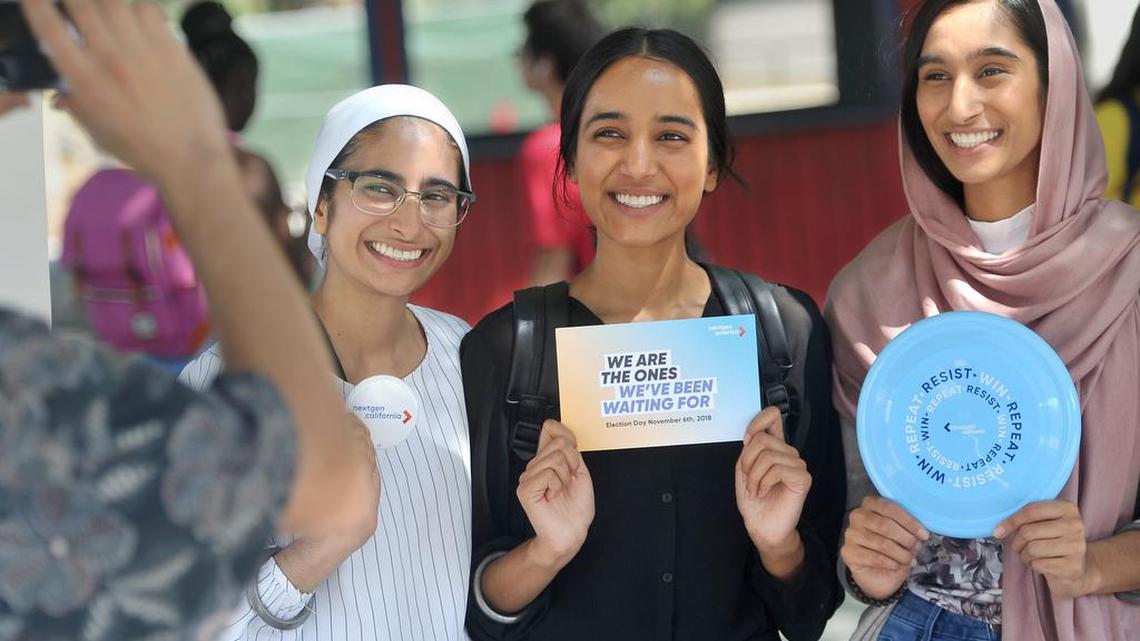 From left, Fresno State students and sisters Harmeet Kaur, Narjot Kaur and Gaganpreet Kaur pose for a photo after Harmeet registered to vote. Her sisters were already registered. Registration took place at the NextGen America booth at Fresno State.