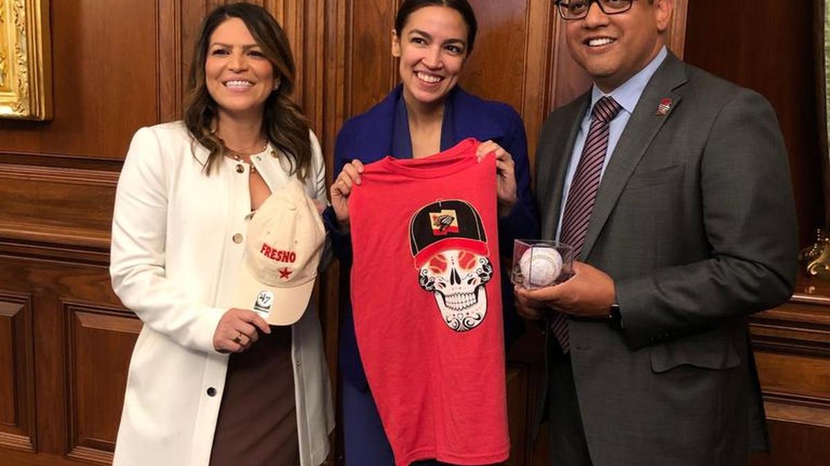 Fresno City Councilmembers Esmeralda Soria, left, and Miguel Arias pose with New York congresswoman Alexandria Ocasio-Cortez with Fresno Grizzlies gear in Washington, D.C. on Wednesday, June 5, 2019.