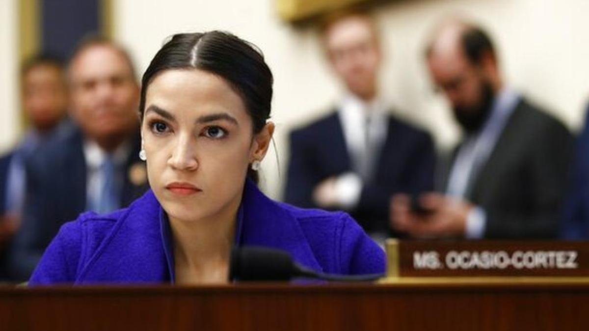 Rep. Alexandria Ocasio-Cortez, D-N.Y., listens during a House Financial Services Committee hearing in this file photo. The Fresno Grizzlies played a Memorial Day video that included an image of Ocasio-Cortez with those of Kim Jong Un and Fidel Castro.