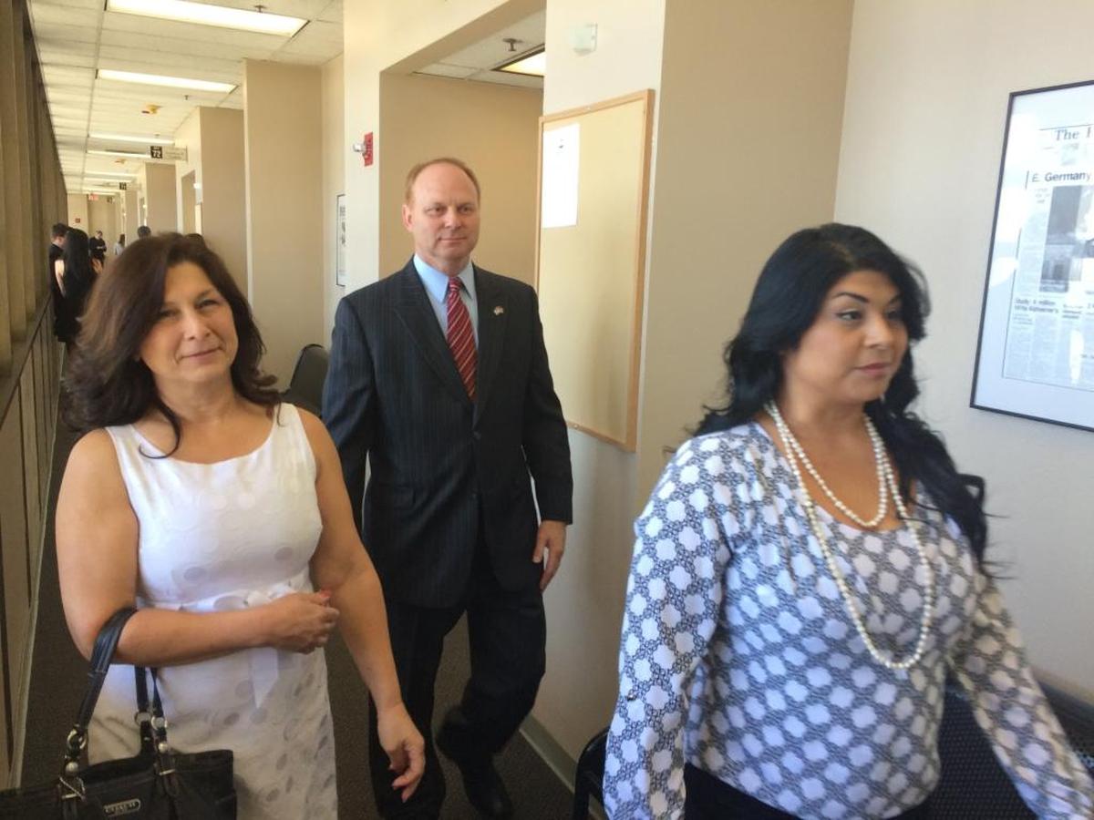 Gail Scarber, left, walks with Kyle Scarber and Gail’s daughter Crystal Reynoso following a hearing in their court case. They pleaded no contest on June 4 to a felony conspiracy charge for helping their son escape to Mexico during his rape trial in 2012. After their pleas, Judge John Gallagher ordered Kyle and Gail Scarber to each perform 500 hours of community service and pay a total of $10,000 in restitution to the state for its criminal investigation. Reynoso pleaded no contest to a misdemeanor conspiracy charge. She was ordered to perform 250 hours of community service.