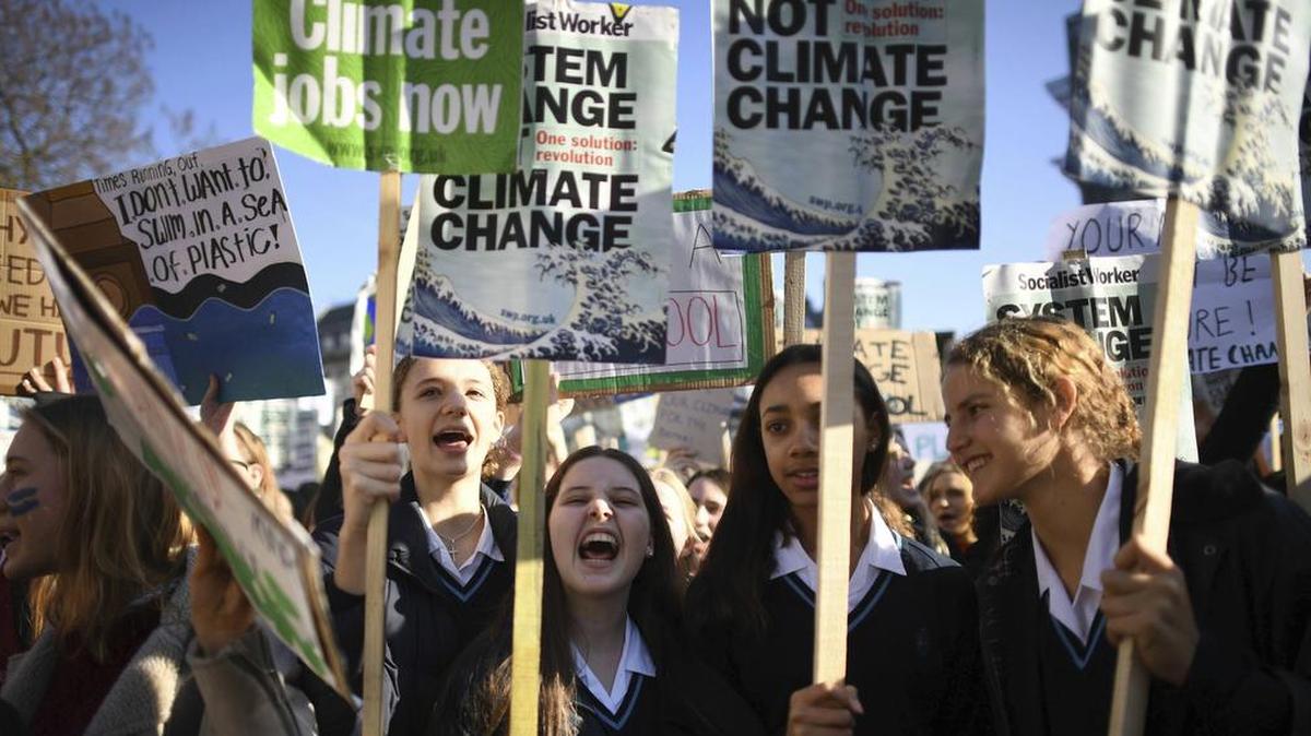 Students join the Youth Strike 4 Climate movement during a climate change protest near Parliament in London, Friday Feb. 15, 2019. The demonstration was one many nationwide to demand action against climate change.
