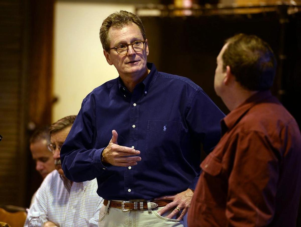 Westlands Water District’s Tom Birmingham speaks with Ron Milligan, right, operations manager for the Central Valley Project, which is run by the U.S. Bureau of Reclamation.