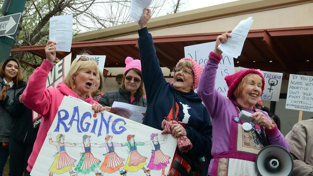 Raging Grannies members, from left, Gail Gaston, 62, of Fresno, Amy Wolk, 51, of El Segundo, Pat Wolk, 83, of Fresno and Kay Pitts, 82, of Fresno, join counter-protesters at a rally at the Planned Parenthood on Saturday, Feb. 11, 2017, in Fresno. Pro-life advocates throughout the country protested outside of Planned Parenthood Clinics as part of a crusade to deny all federal funding to organizations that provide essential health services, including abortions, to millions of people.