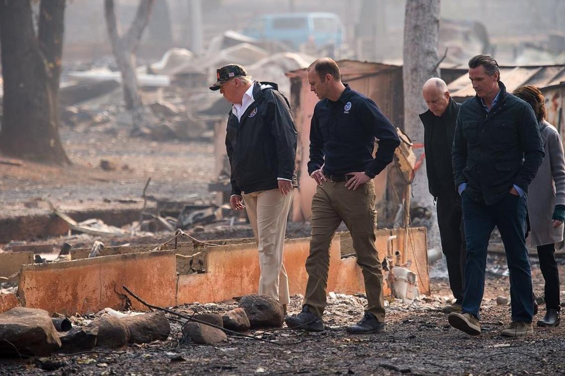 President Donald Trump, FEMA Director Brock Long, Gov. Jerry Brown, Gov.-elect Gavin Newson and Paradise mayor Jody Jones tour the Skyway Villa Mobile Home and RV Park during Trumpâ€™s visit of the Camp Fire in Paradise, Calif. on Saturday, November 17, 2018.
