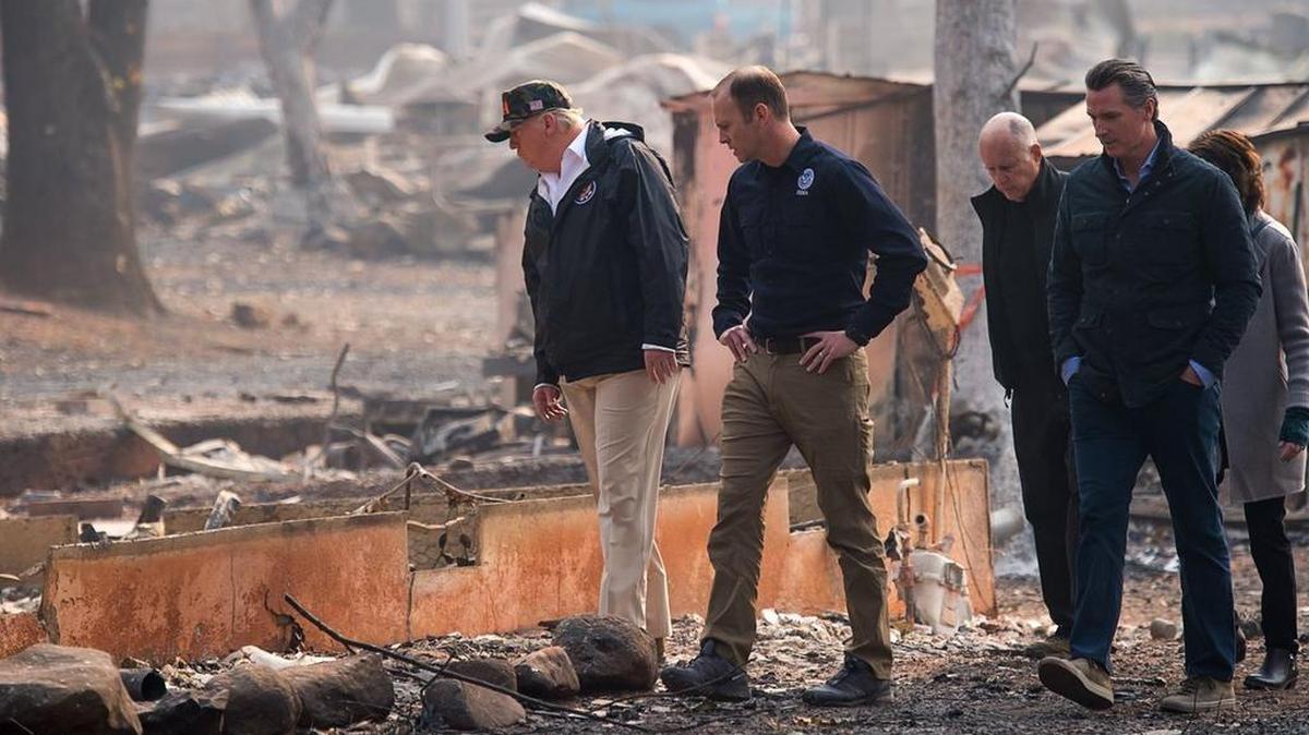 President Donald Trump, FEMA Director Brock Long, then Gov. Jerry Brown, then Gov.-elect Gavin Newson and Paradise Mayor Jody Jones tour the Skyway Villa Mobile Home and RV Park during Trump’s visit of the Camp Fire in Paradise, on Saturday, Nov. 17, 2018.