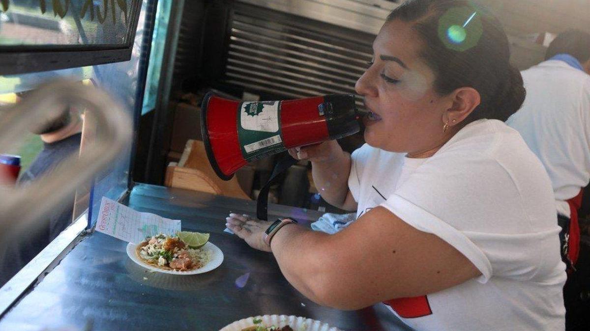 El Mexicano owner Jovita Camacho calls out orders through a bullhorn from inside her taco truck last year during the Taco Truck Throwdown 7 at Chukchansi Park in Fresno. Judges voted El Mexicano of Fowler winner of the competition.