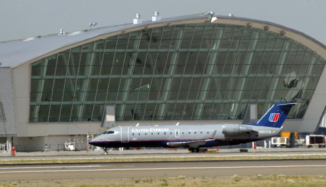 A United Express flight operated by Utah-based SkyWest Airlines rolls on the taxiway at Fresno Yosemite International Airport.