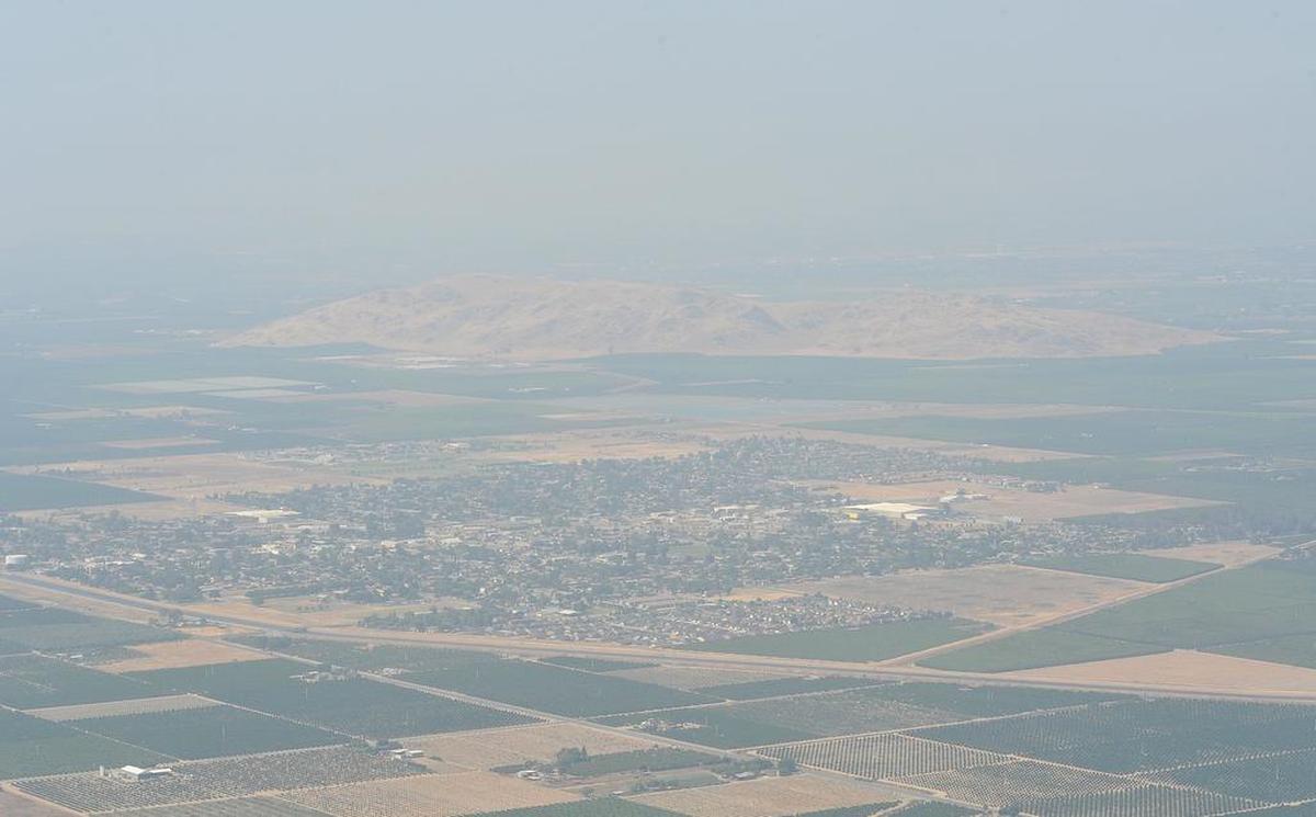 The city of Orange Cove sits in the smoggy San Joaquin Valley air on May 23, 2018.