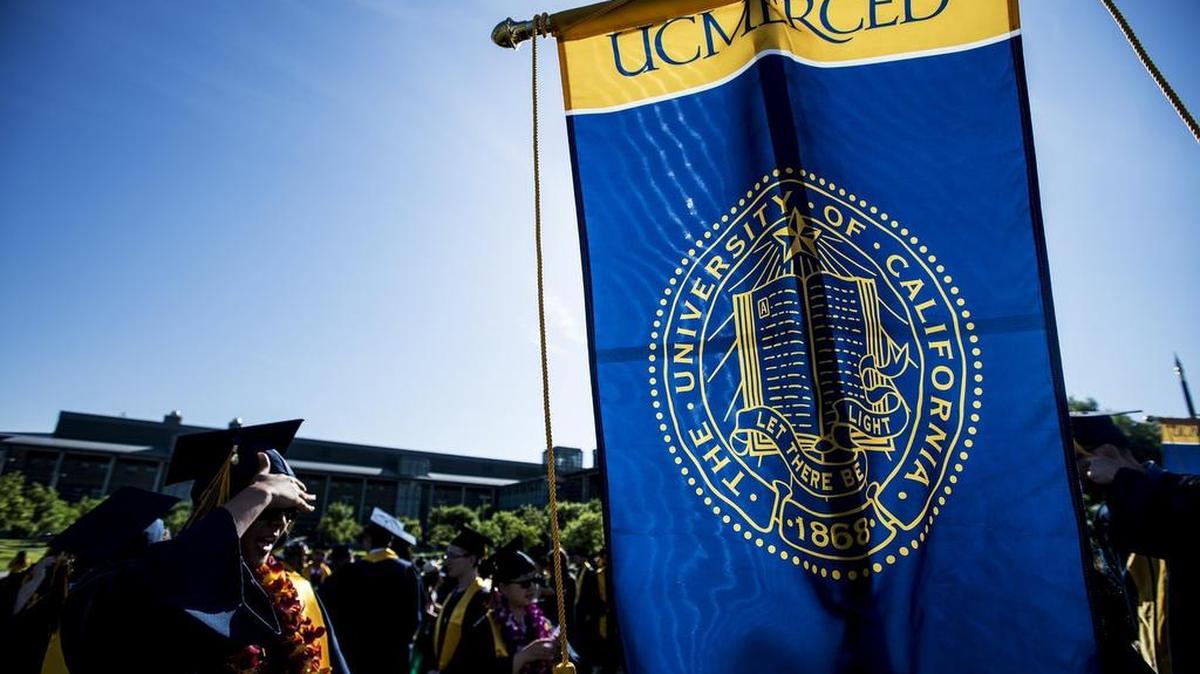 University of California, Merced graduates gather at the campus sculpture titled “Beginnings” prior to the commencement ceremony for the School of Engineering and the School of Natural Sciences, in the university's South Bowl, in Merced, in 2015. More than 500 students received degrees.