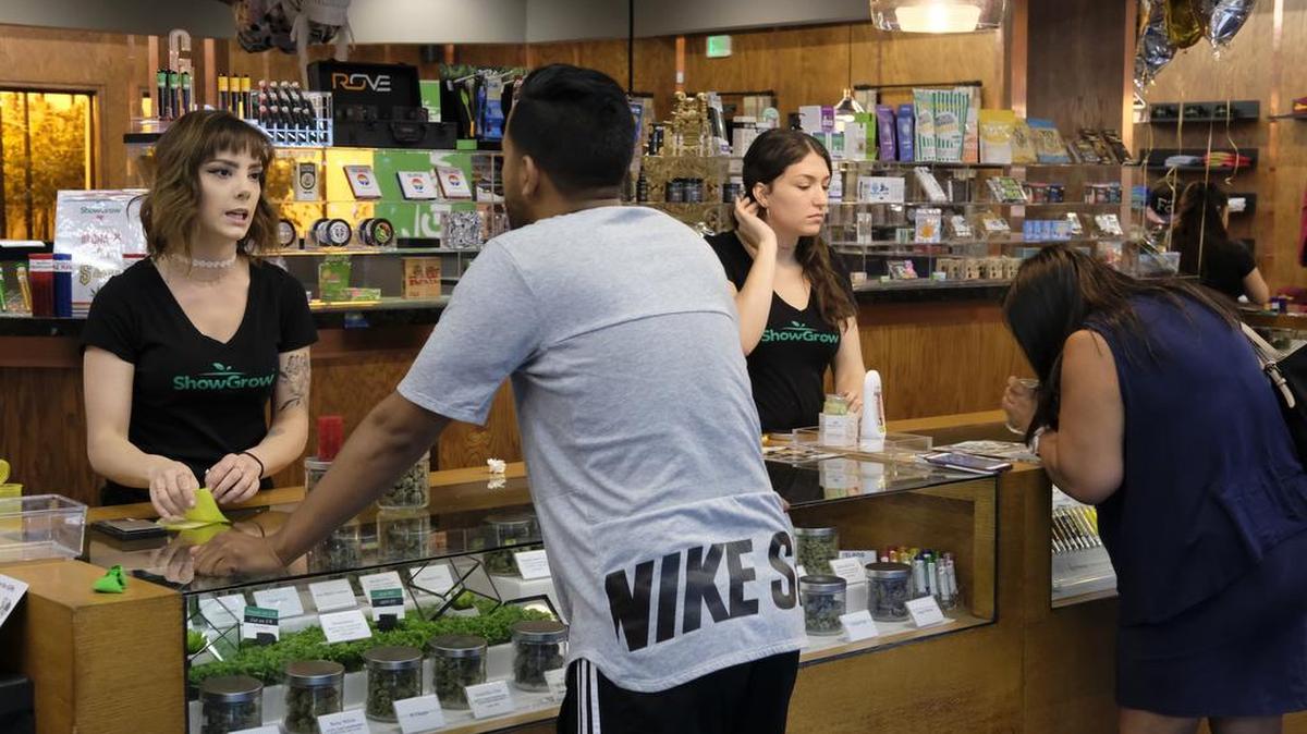 In this April 20, 2017 photo, customers shop at ShowGrow, a medical marijuana dispensary in downtown Los Angeles. Fresno is working to open medical marijuana dispensaries.