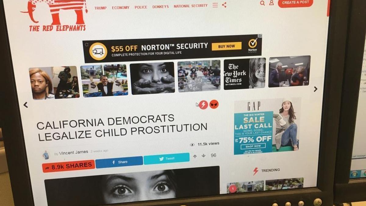 A fake news story is positioned near ads from major corporations on The Red Elephants website in January 2017. U.S. intelligence officials say Russian trolls ran a disinformation campaign in the 2016 election and will try again.