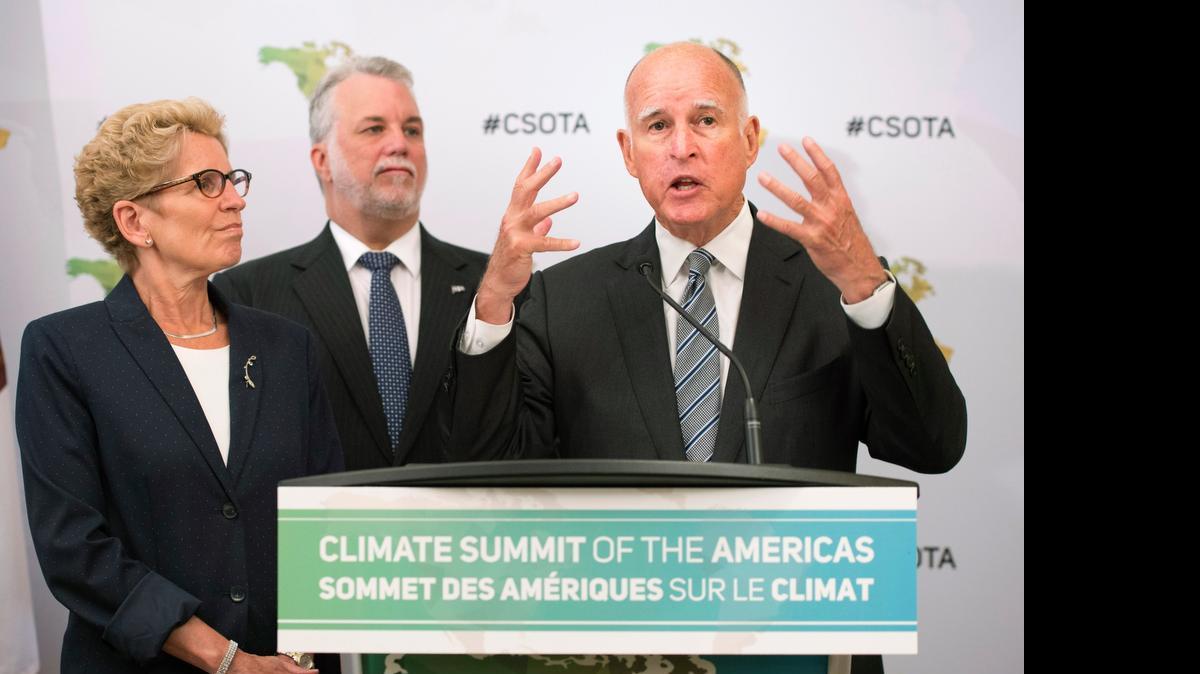 
California Gov. Jerry Brown, right, speaks at the Climate Summit of the Americas in Toronto on Wednesday. 
