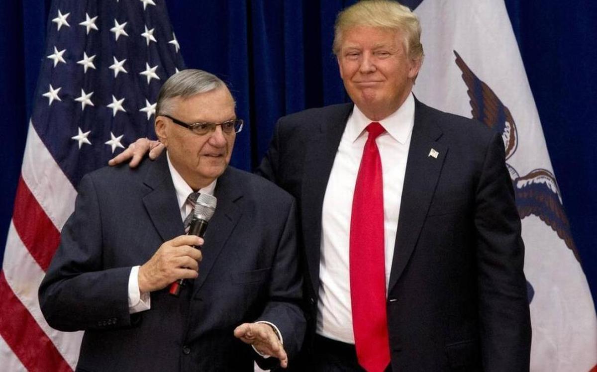 In this Jan. 26, 2016 file photo, then-Republican presidential candidate Donald Trump is joined by Joe Arpaio, the sheriff of metro Phoenix, at a campaign event in Marshalltown, Iowa. Trump has since pardoned Arpaio.