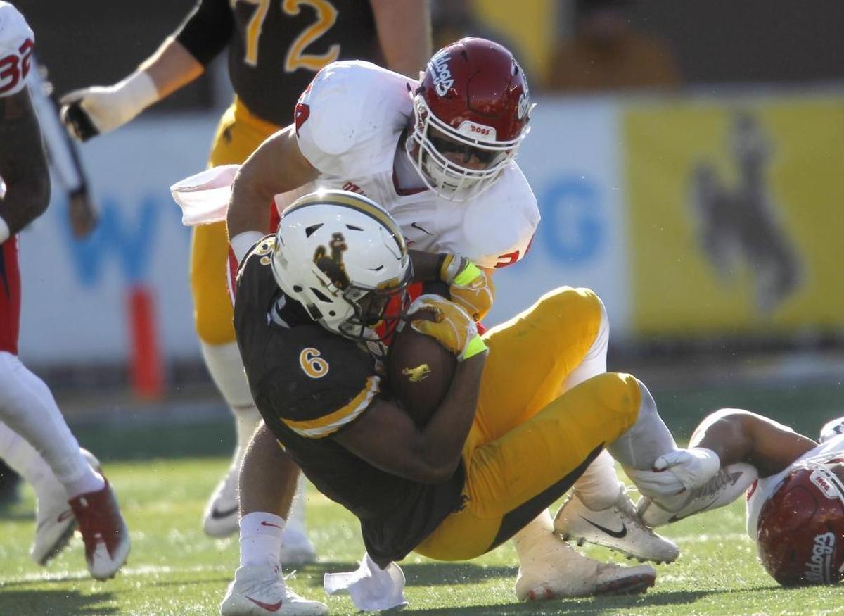 Wyoming’s Marcus Epps absorbs a hit by Fresno State linebacker George Helmuth during the Bulldogs’ 13-7 victory at War Memorial Stadium on Nov. 18, 2017. Helmuth was named MW Defensive Player of the Week after making 11 total tackles and a fumble recovery.
