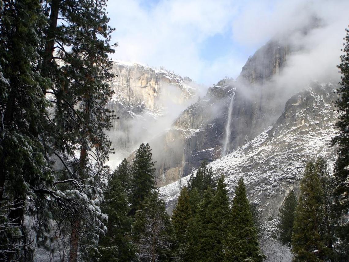 Yosemite Falls flows following a February 2012 storm that dropped an inch of snow in Yosemite Valley and about 9 inches at Badger Pass. Yes, you can still call it Yosemite but the National Park Service has announced it is changing names of some of the park’s best-known man-made landmarks in a trademark dispute with ousted concessionaire Delaware North.