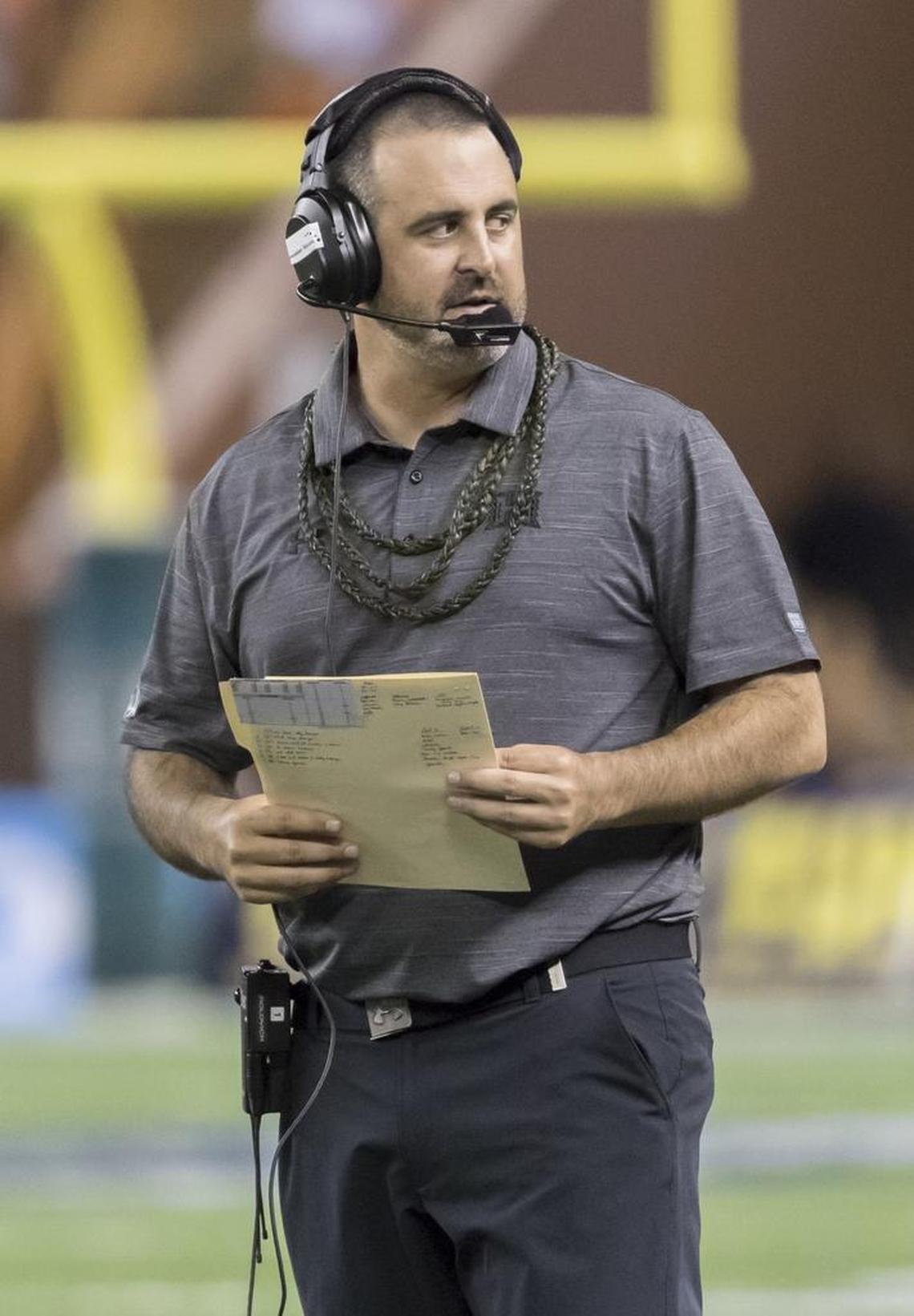 Hawaii football coach Nick Rolovich on the sidelines during a 2016 loss at Michigan. The former Rainbow Warriors quarterback treasures his school’s longtime rivalry with Fresno State, which marks its 50th edition Saturday. “To me, it’s very personal,” he said.