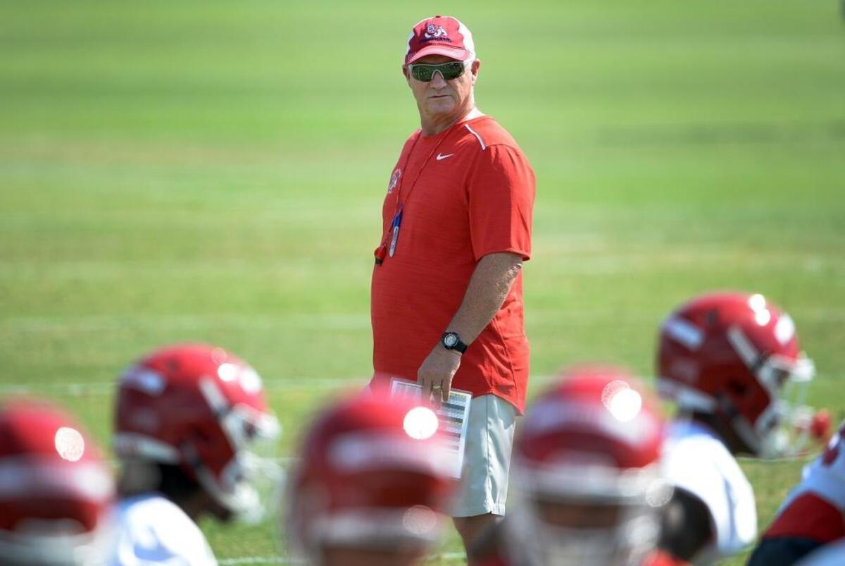 Fresno State coach Jeff Tedford walks the sideline during fall camp. “Everybody is buying into what Coach Tedford is teaching us,” quarterback Chason Virgil said.