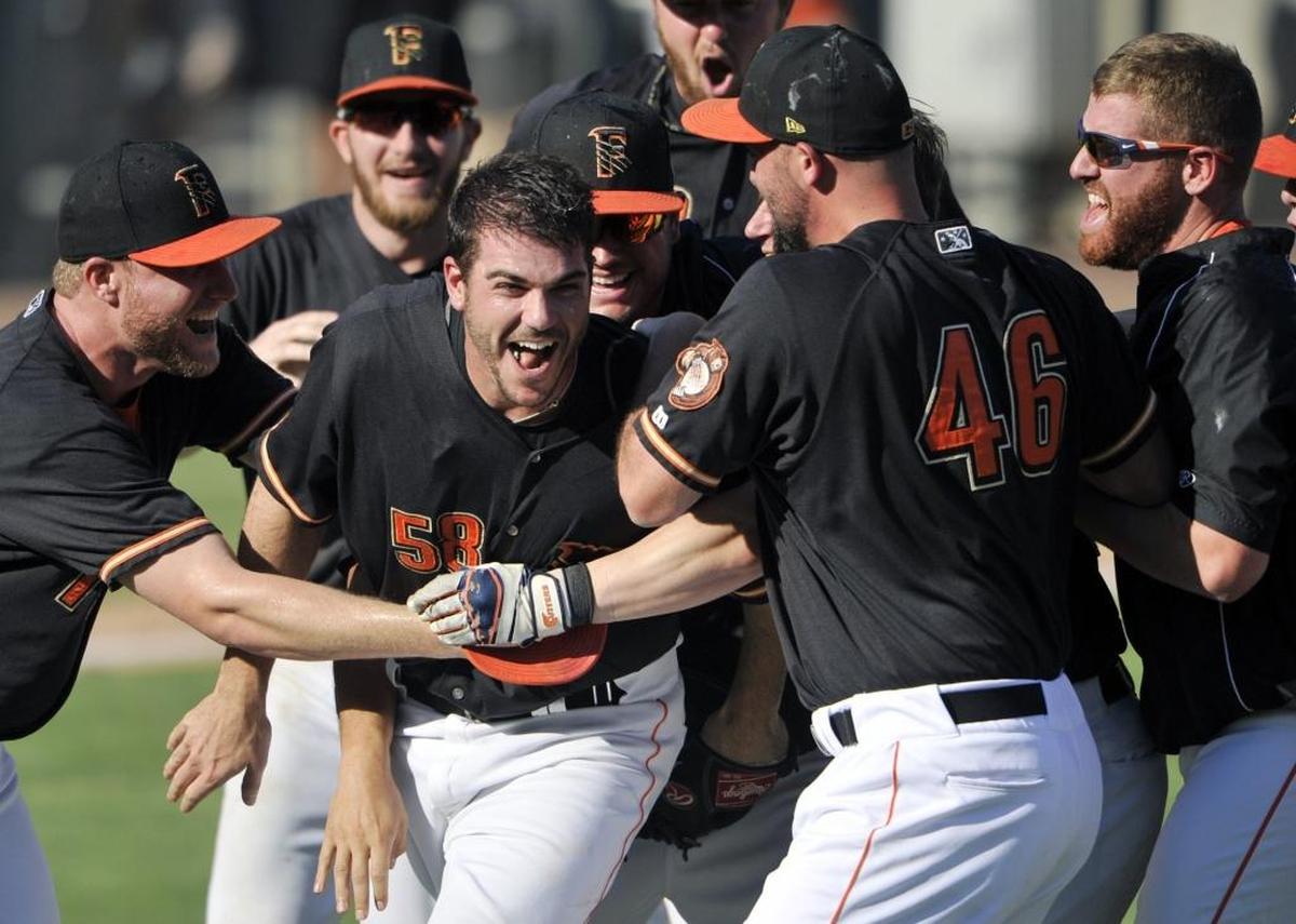 Fresno Grizzlies pitcher James Hoyt, center, celebrates with teammates after recording the final out of a 7-3 victory over Round Rock in Game 5 in Game 5 of the 2015 Pacific Coast League championship series at Chukchansi Park.