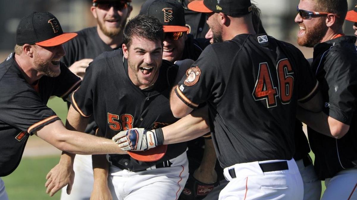 Fresno Grizzlies pitcher James Hoyt, center, celebrates with teammates after recording the final out of a 7-3 victory over Round Rock in Game 5 in Game 5 of the 2015 Pacific Coast League championship series at Chukchansi Park.