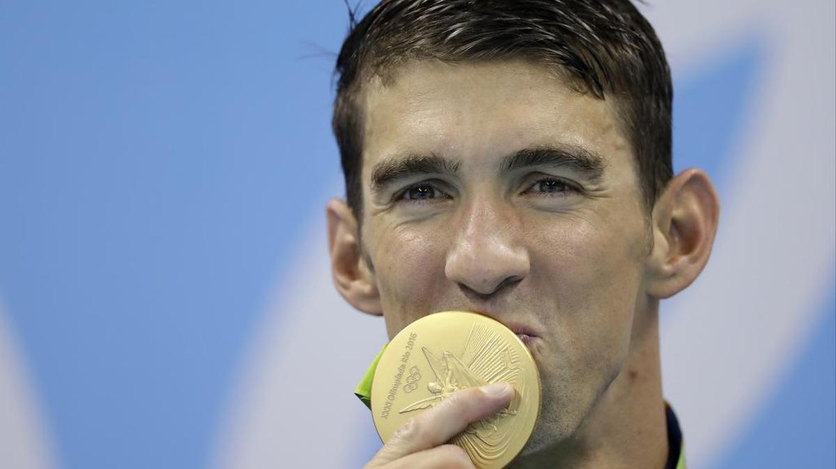 The United States’ Michael Phelps kisses his gold medal after the men’s 4x100-meter freestyle final during the swimming competitions at the 2016 Summer Olympics, Monday, Aug. 8, 2016, in Rio de Janeiro, Brazil.