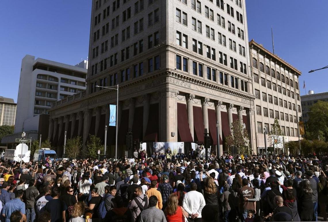 A large crowd gathers at the corner of Fulton and Mariposa streets, in front of the Pacific Southwest Building, for speeches commemorating the official reopening of Fulton Street on Oct. 21, 2017.
