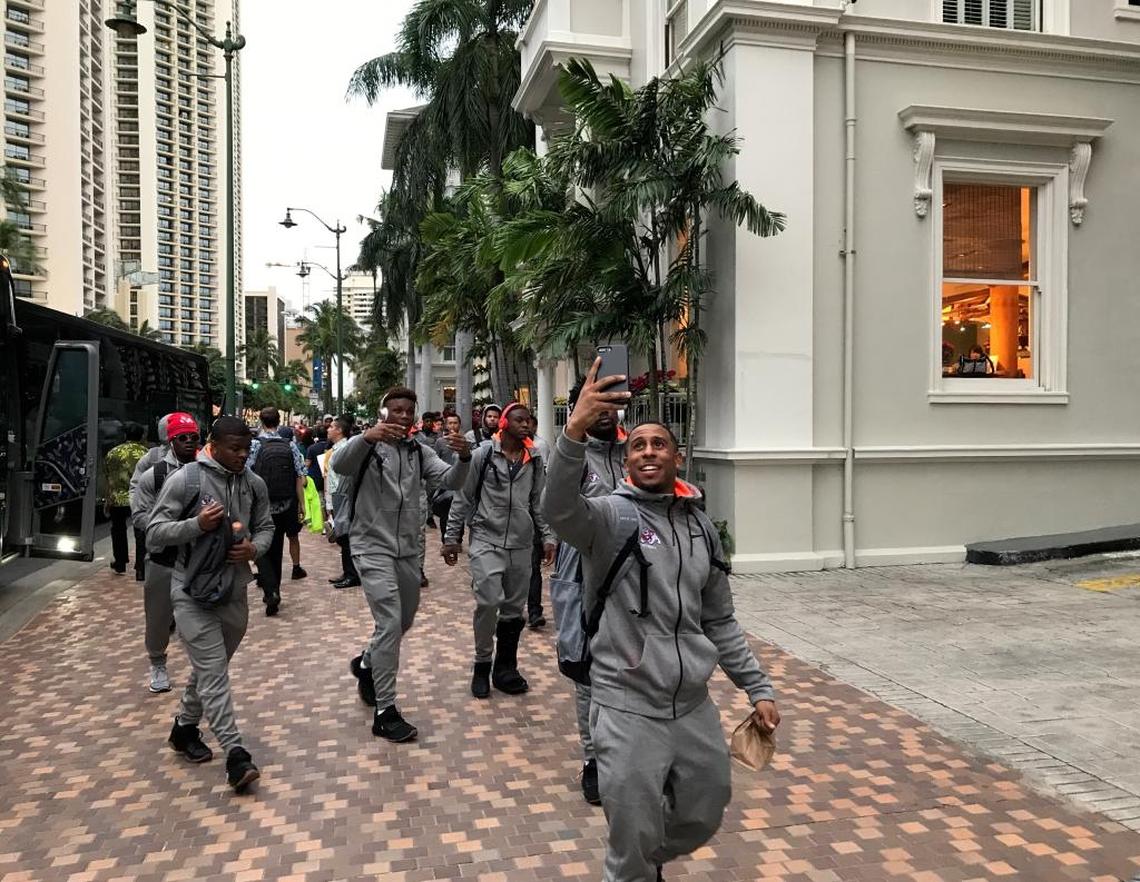 Senior Austin Harper uses his phone to capture the sights and sounds of Waikiki after the Fresno State Bulldogs arrived at their team hotel for Sunday’s Hawaii Bowl.