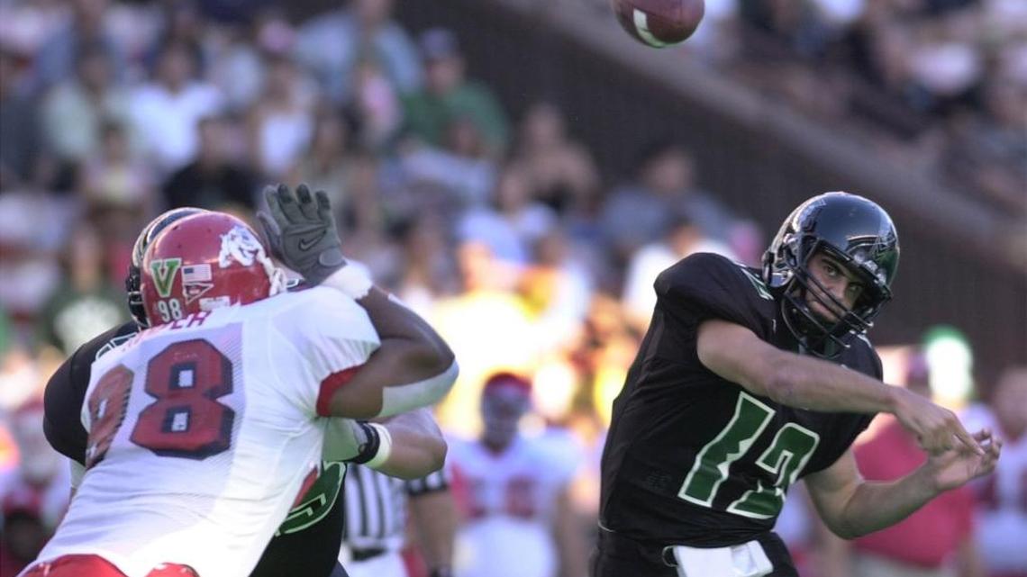 Hawaii quarterback Nick Rolovich unleashes a pass during the 2001 game between the Rainbow Warriors and Fresno State at Aloha Stadium in Honolulu. The 38-year-old Rolovich is now in his second season as Hawaii head coach.
