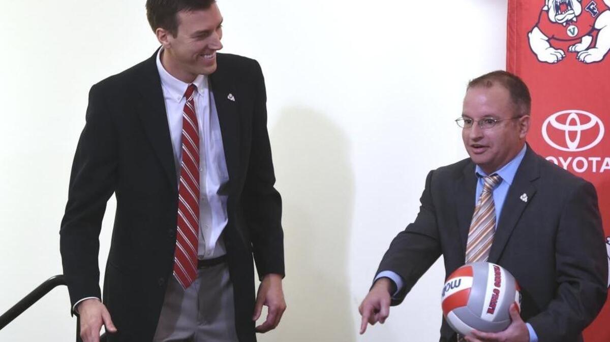 Fresno State interim athletics director Steve Robertello, right, introduces Jonathan Winder as the Bulldogs’ new volleyball coach during a January news conference. Robertello is one of five finalists to become the next athletics director at Fresno State. Interviews with the search committee will start on Thursday, June 14, 2018.