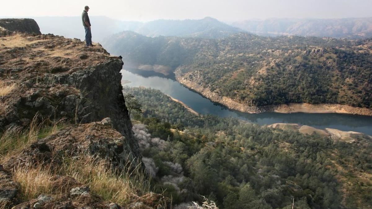 Logan Page looks over the gorge containing the upper reaches of Millerton Lake near Temperance Flat in this file photo. The proposed Temperance Flat dam would be beyond the first ridge in the center of the photo.