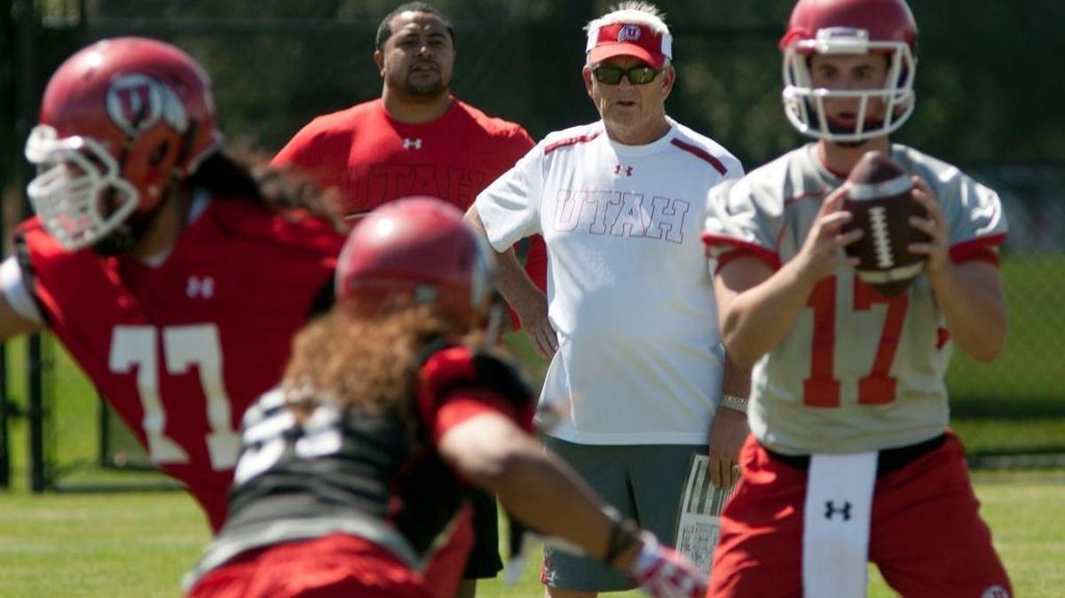 Dennis Erickson, center, returned to coaching in 2013 as a Utah assistant after taking a year off following his dismissal at Arizona State.